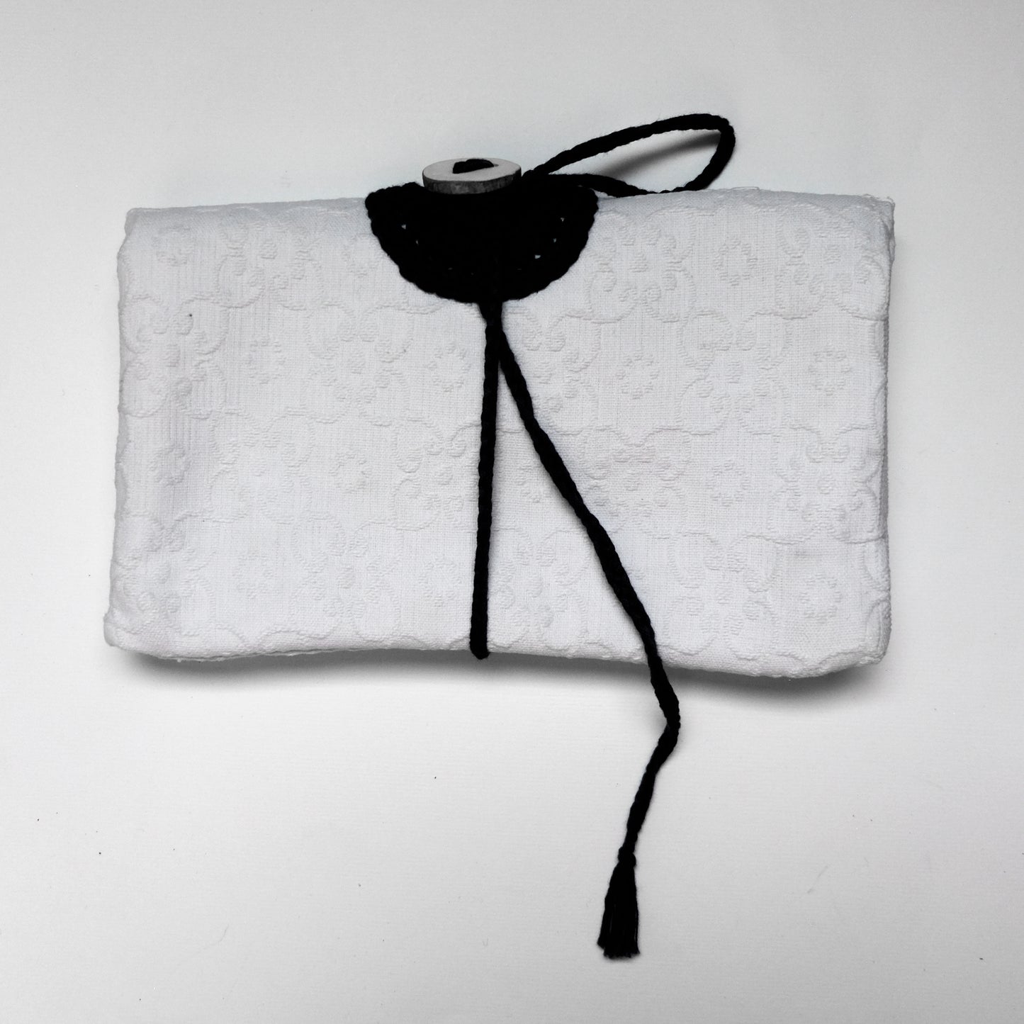 Custodia imbottita con bottone in legno