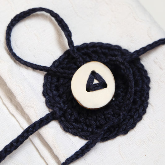 Custodia imbottita con bottone in legno