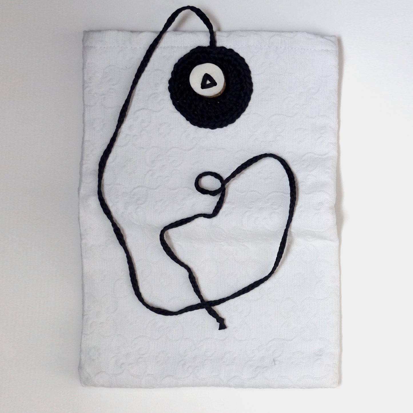 Custodia imbottita con bottone in legno